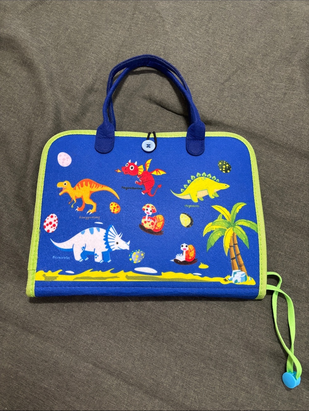 Blue Dinosaur felt busy book with button closure